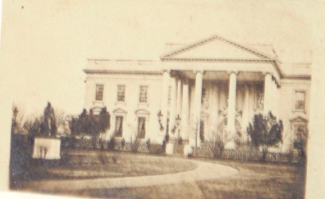 Recently discovered and published Warren photo taken on March 6, 1865. The image shows the White House. However when closely inspected, an image of a tall bearded man can be seen. Experts are 'cautiously optomistic' about the possibility that this is Abraham Lincoln.