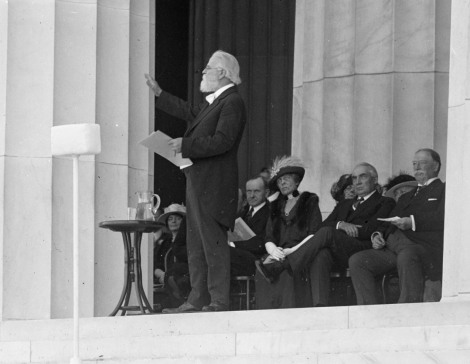Poet Edwin Markham reads a verse to the crowd at the Dedication Celebration. Behind him sits Vice President Calvin Coolidge, President Warren Harding and Chief Justice William Howard Taft.